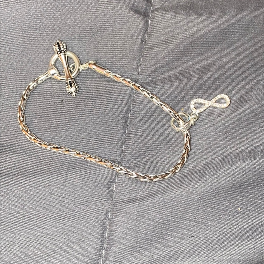 Charm bracelet with infinity charm.